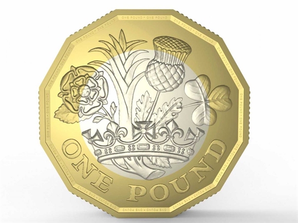 Một mặt của đồng xu 1 bảng Anh mới (Ảnh: Business Insider)