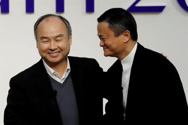 Masayoshi Son, left, and Jack Ma in Tokyo late last year. PHOTO: KIM KYUNG-HOON/REUTERS