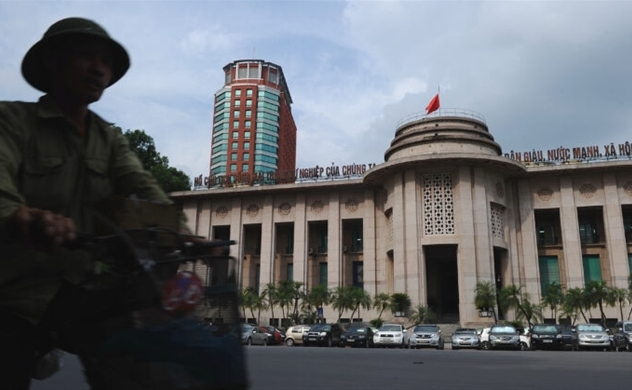 Vietnam seeks low market interest rates amid a rare rate increase.